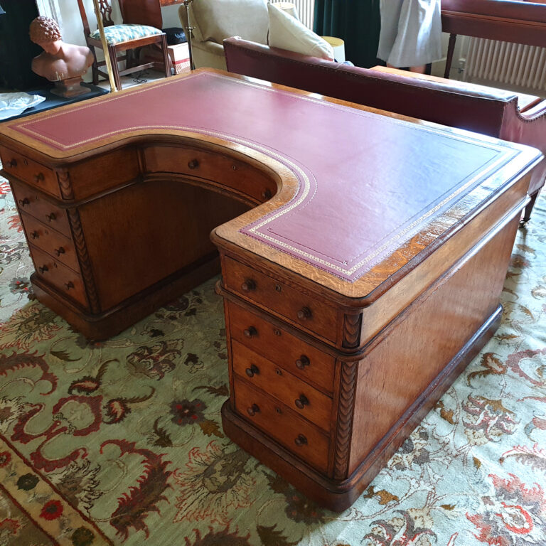 An important 19th Oak Century Horseshoe Desk
